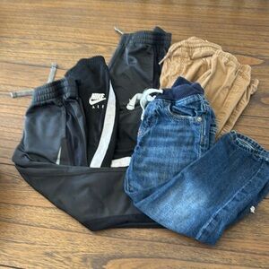 5 pairs of gently used pants, 3 Nike,Gap Jeans, old navy kakapo pants